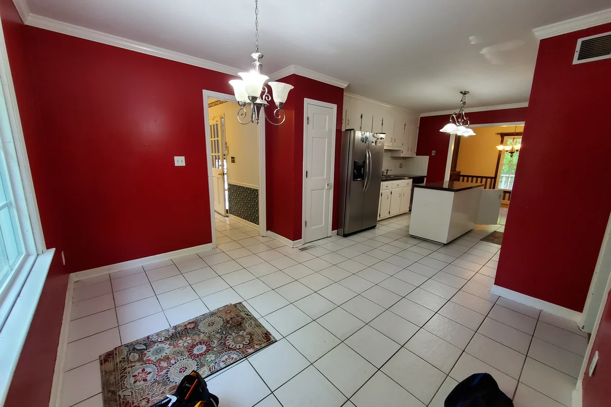 Dated kitchen and dining area before remodeling