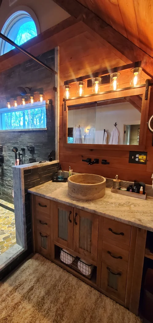 Rustic bathroom vanity with vessel sink and custom lighting