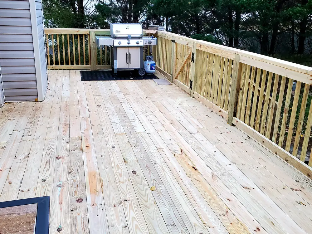 Finished deck with pressure-treated railings