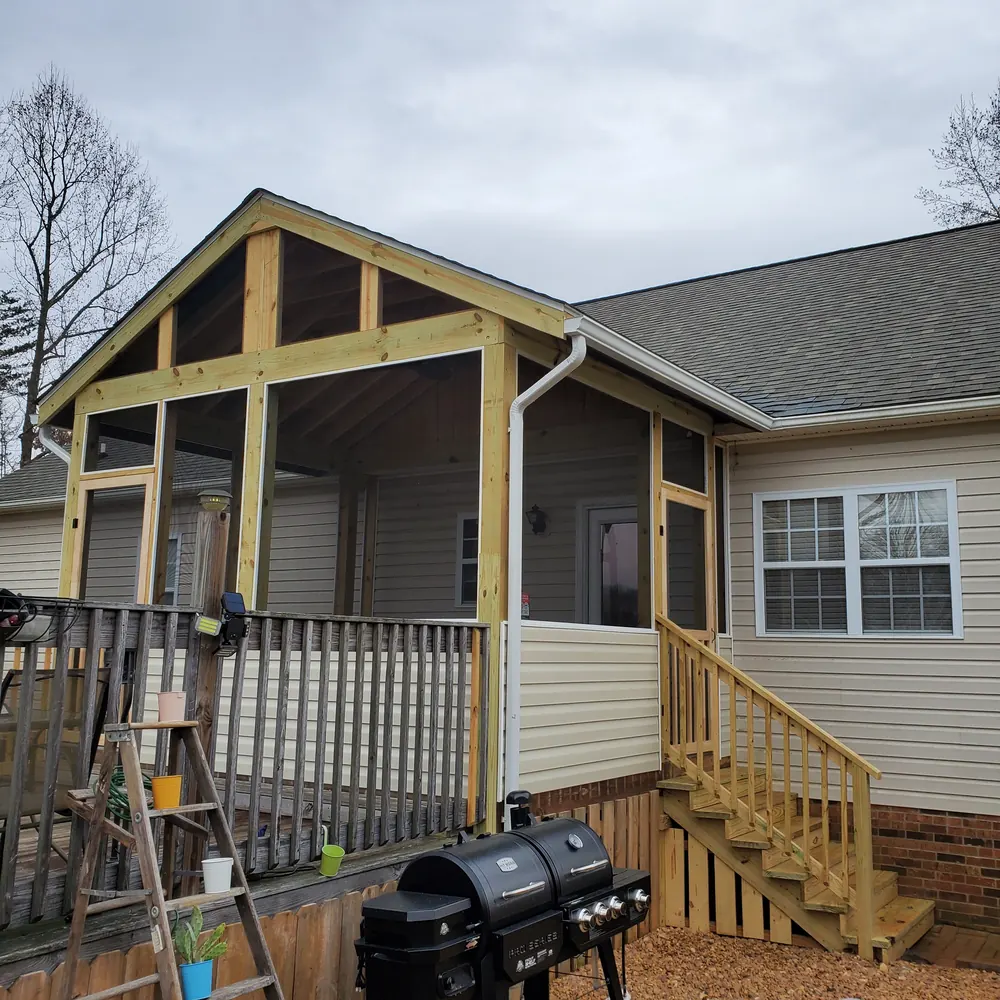 Newly built screened porch with gable roof, pressure-treated frame, vinyl kneewall and new stairs